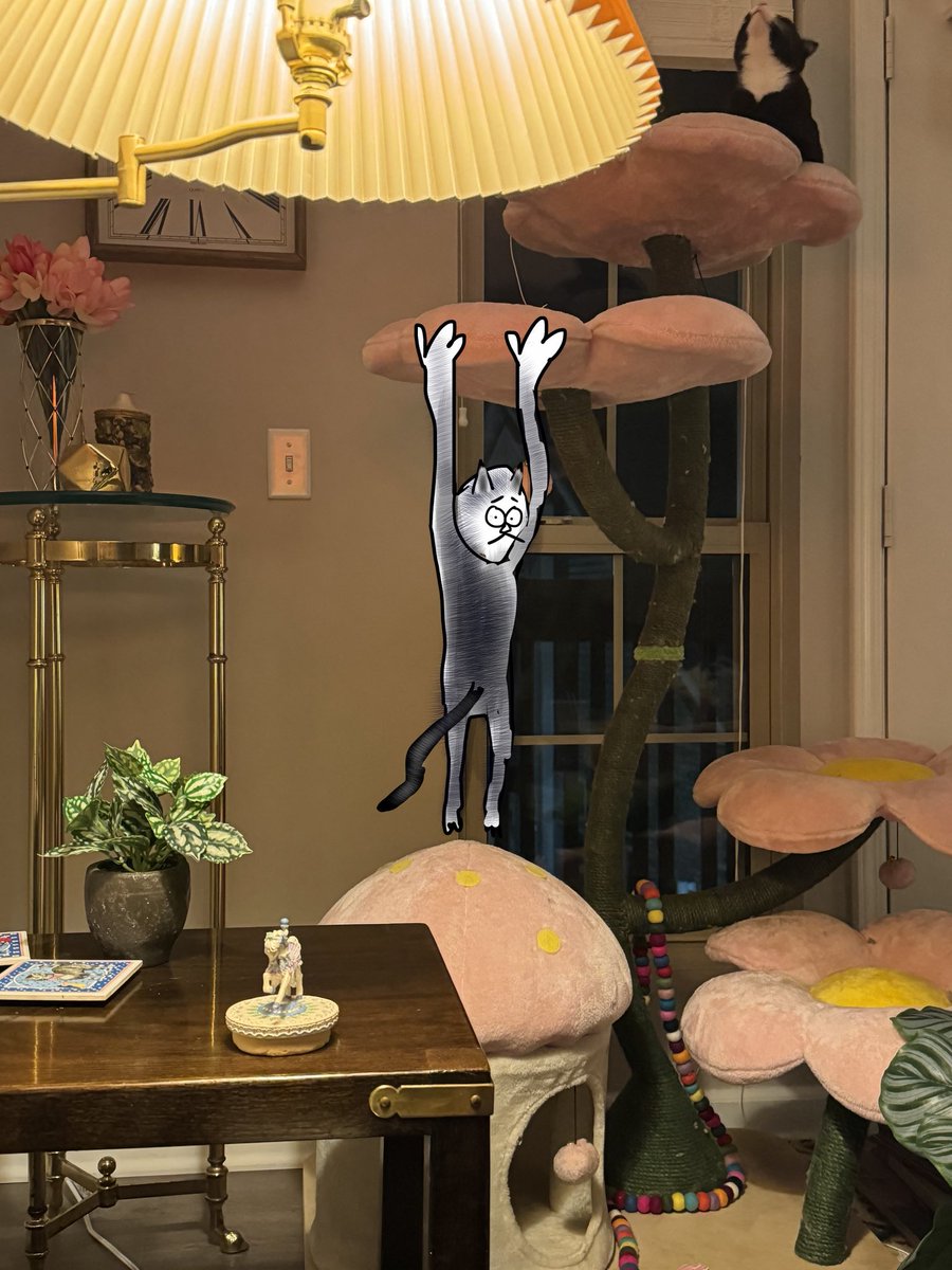 My cat had a bad jump and barely caught the cat tree but she desperately held on for like 5 seconds and right before she let go she turned and looked at me with panic in her eyes while hanging there like this