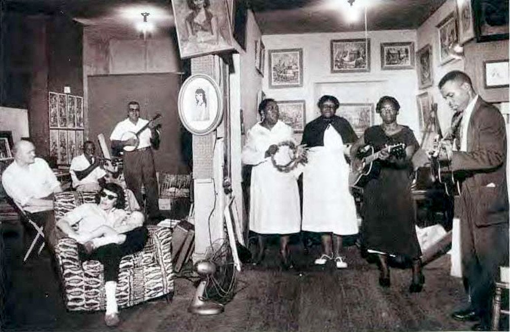 Early Discordian Barbara Reid with daughter on her lap at Preservation Hall, the legendary French Quarter music venue still in operation, early 1960s.

Courtesy of Louisiana Music Magazine, Winter 2012 via the Discordian Archives.