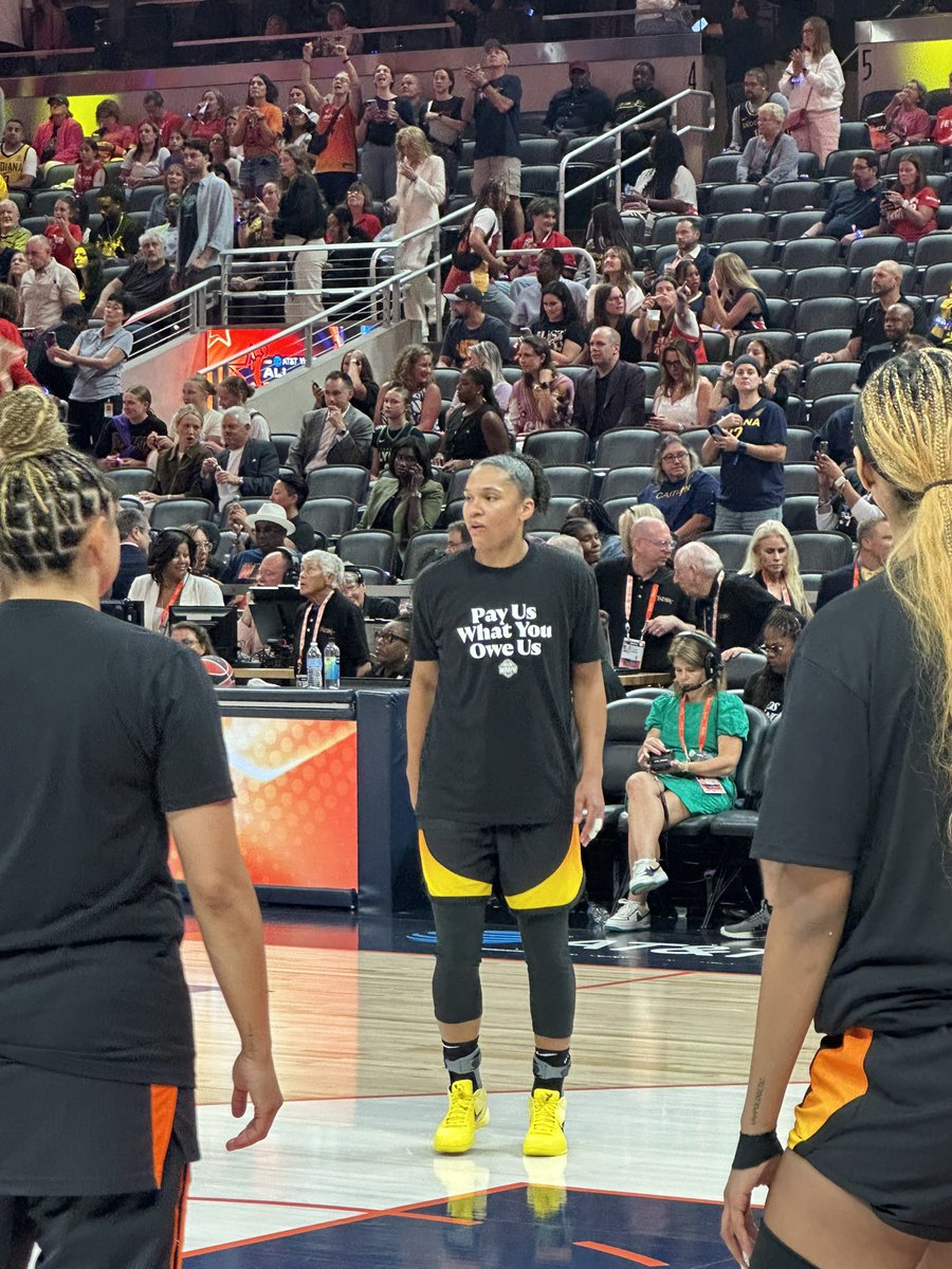 colincsalao's tweet image. WNBA All-Stars shirts under their warm-ups reads:
“Pay Us What You Owe Us.”