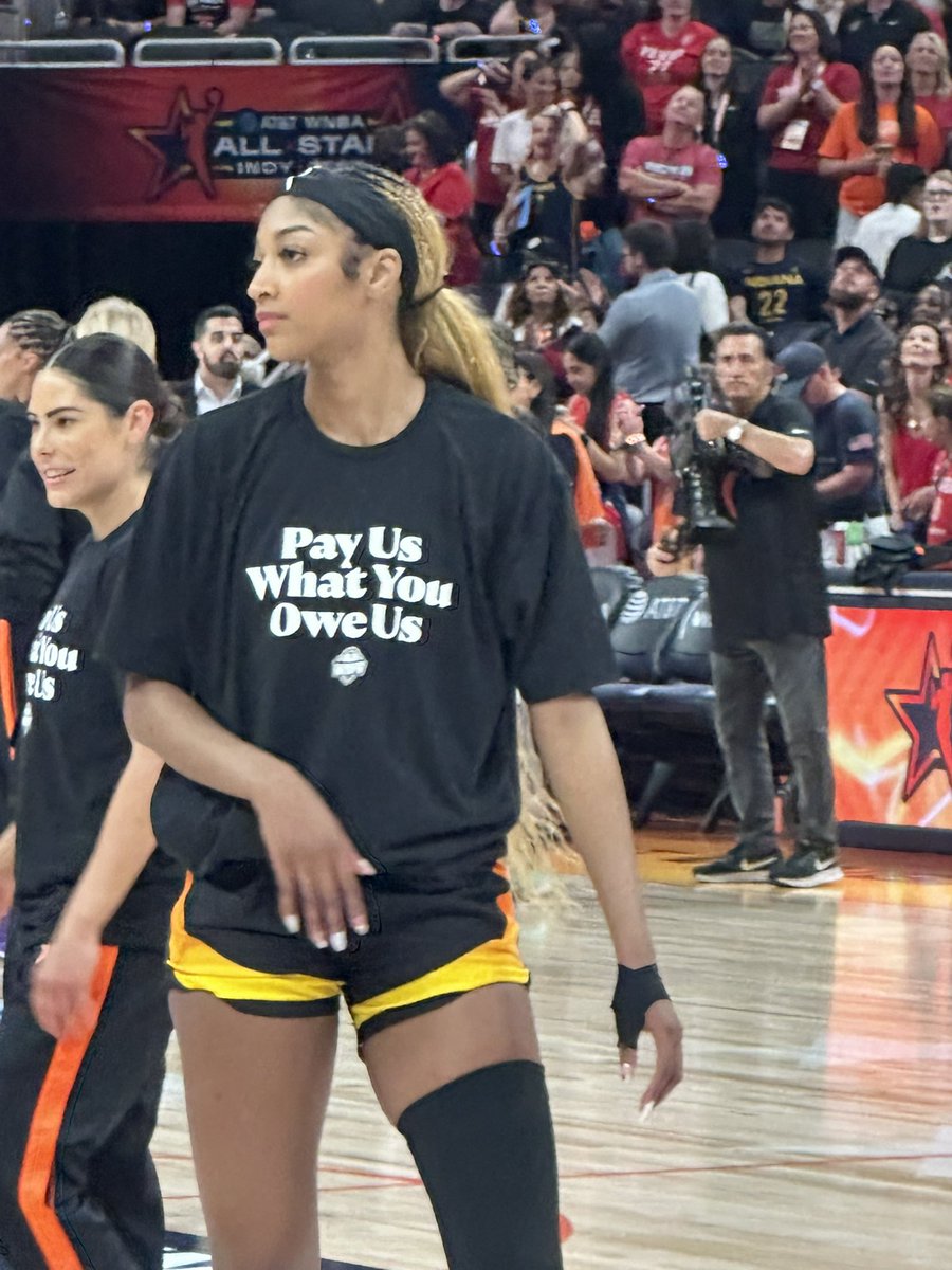 colincsalao's tweet image. WNBA All-Stars shirts under their warm-ups reads:
“Pay Us What You Owe Us.”