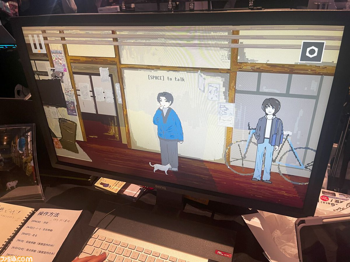 famitsu's tweet photo. 京都大学にある日本最古の学生寮「吉田寮」が舞台。“人語を話す猫”になってクセつよ寮生たちとの共同自治を体験
https://t.co/xWmmy82QFn

『吾輩は寮生である』は、吉田寮の寮生・元寮生が中心となって開発中のゲーム。果たして、“喋れるネコ”は寮生としての権利を得られるのか？
#BitSummit13th https://t.co/2vpPwojx0A