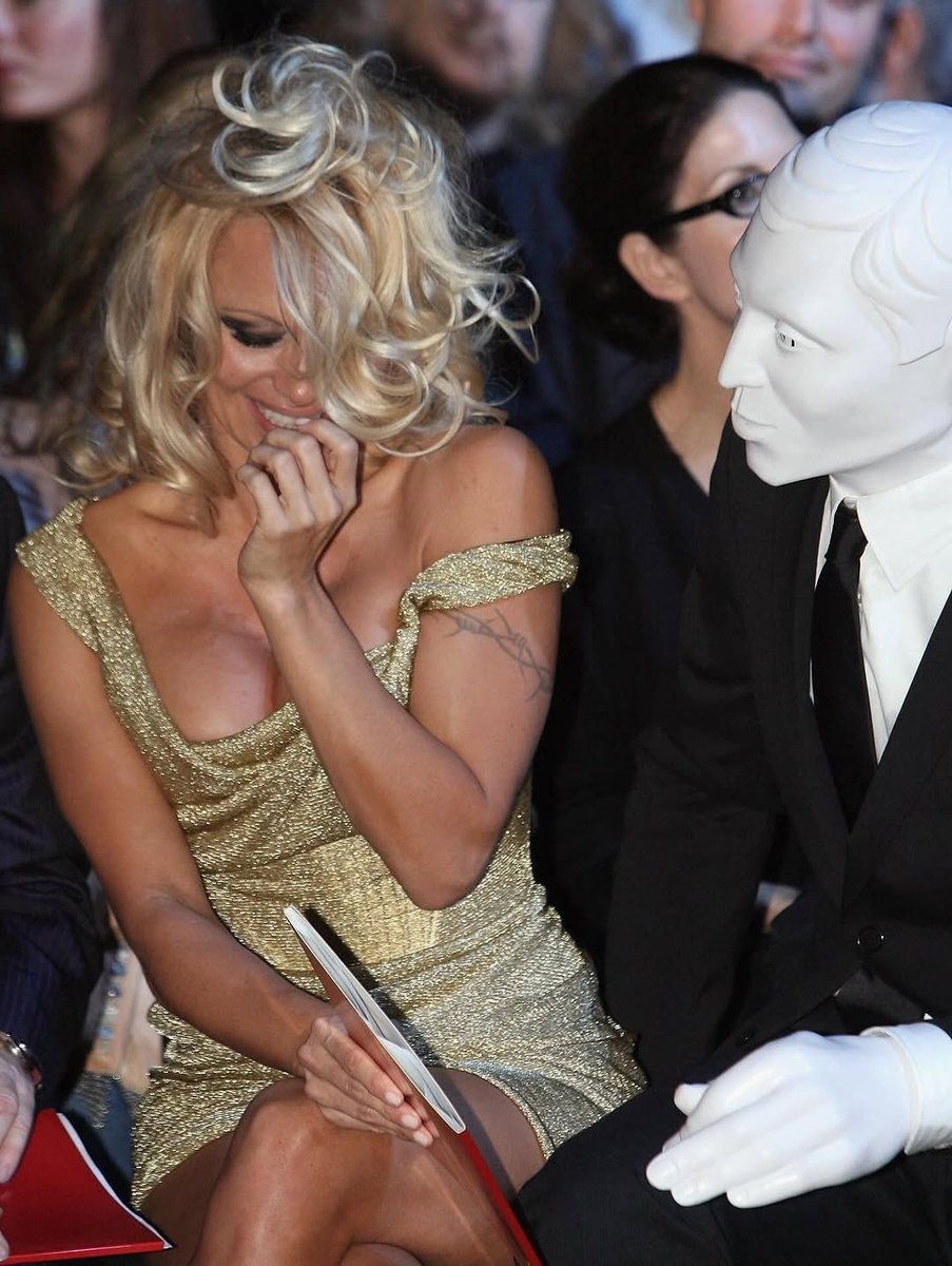 rogue's tweet image. In 2008, Pamela Anderson attended the Vivienne Westwood SS08 fashion show in London with a masked mystery date who many speculated was Michael Jackson in disguise