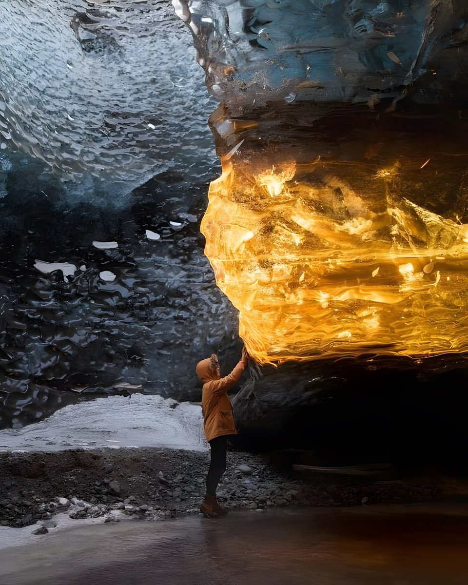 The suns rays reflect on a piece of ice in a cave in Iceland, moments before sunset.
