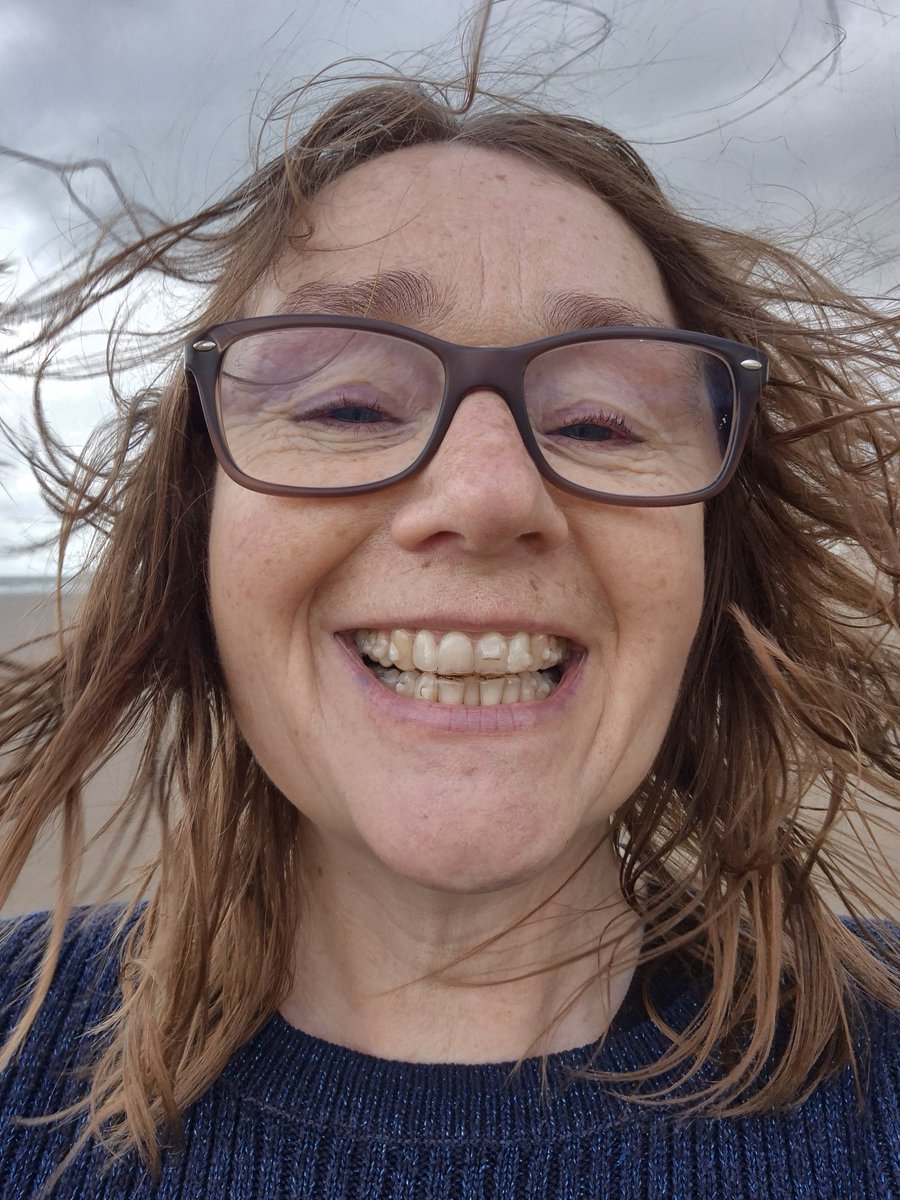 New Invisalign challenge: reinserting on a very windy beach after a cup of coffee.