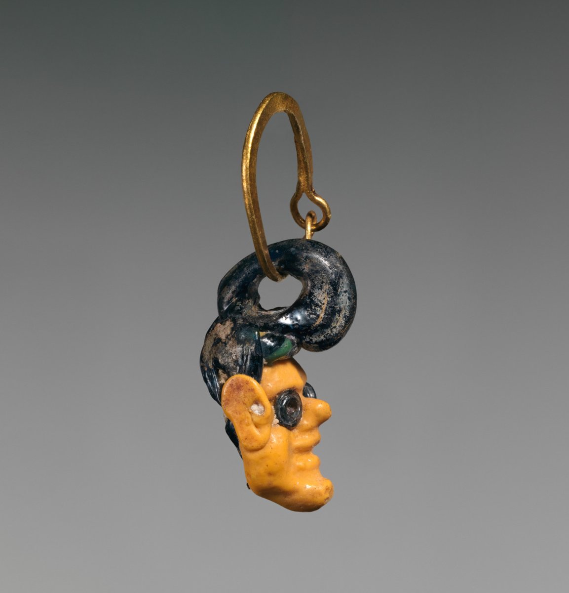 Glass head pendant on a gold earring
Phoenician or Carthaginian
3rd–1st century B.C.
Hellenistic Period