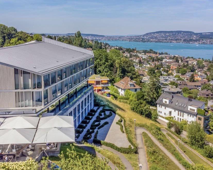 a) This is Rüschlikon, a town in Switzerland. It’s one of best places to live on earth.

b) Town was built with funds from Zambian Mines, Mopani Mine of Glencore 

c) Rüschlikon has a 2% unemployment rate.

Mufulira, our Zambian town, which financed this Swiss town has a 76% rate