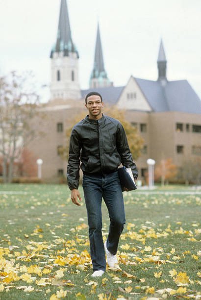 MUOverload's tweet image. Doc Rivers (@DocRivers) walks through the @MarquetteU campus on his way to class during the 1982-83 @MarquetteMBB season #mubb
