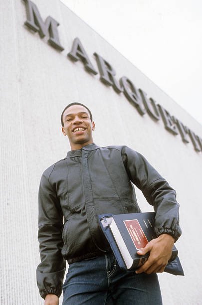 MUOverload's tweet image. Doc Rivers (@DocRivers) walks through the @MarquetteU campus on his way to class during the 1982-83 @MarquetteMBB season #mubb