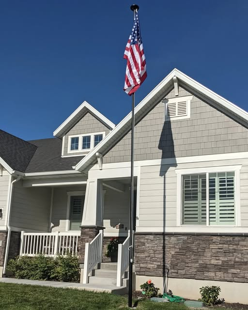 Paulspound's tweet image. Found out it was 4 years ago today that I planted my flag in my front yard. Been flying high with pride every day since. (The yard landscape has changed but not the flag post.)