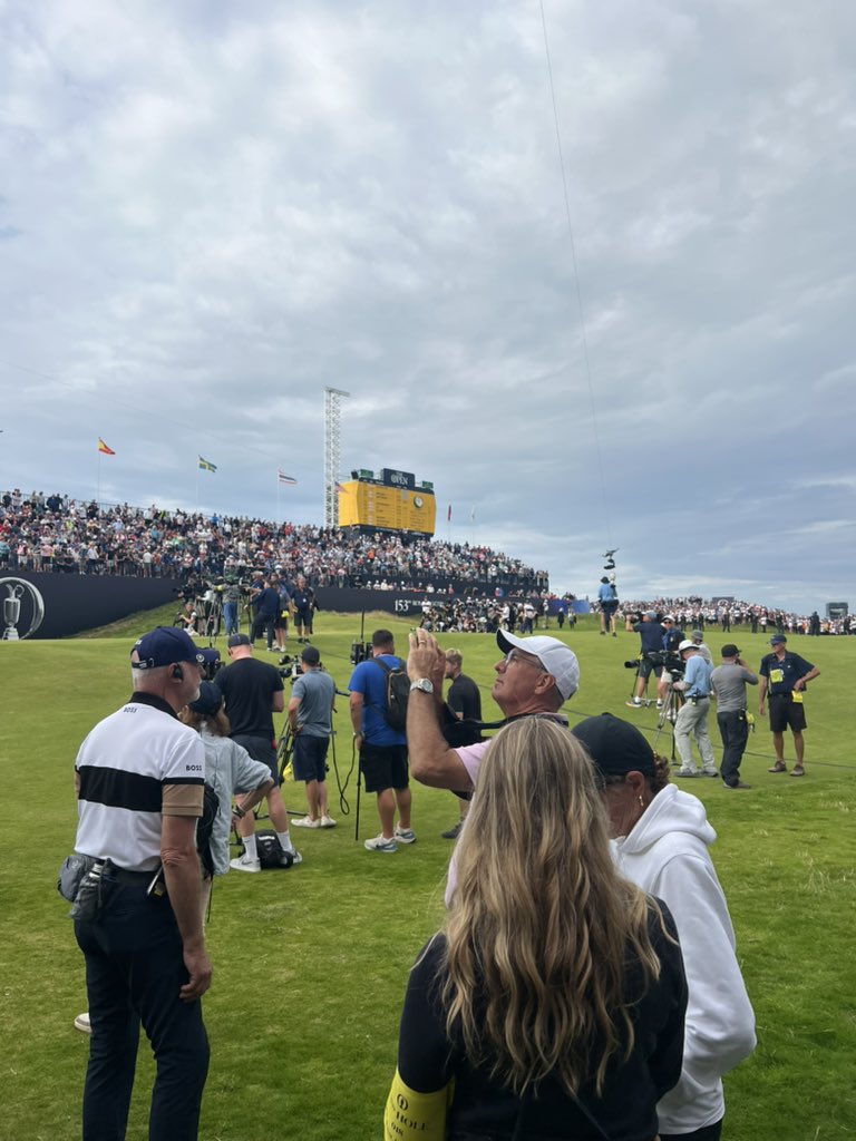 PaulHodowanic's tweet image. Proud dad moment for Scott Scheffler, videoing the scene at 18 after his son Scottie Scheffler wins The Open