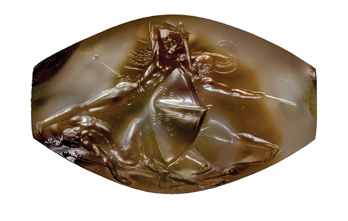 nchlsswft's tweet image. Still in awe of this Bronze Age sealstone found at Pylos ten years ago. It's only 3.6 cm long (1.42 in.), but just look at the hair, the muscles, the sword, the patterned kilt, and that limp, dead arm.