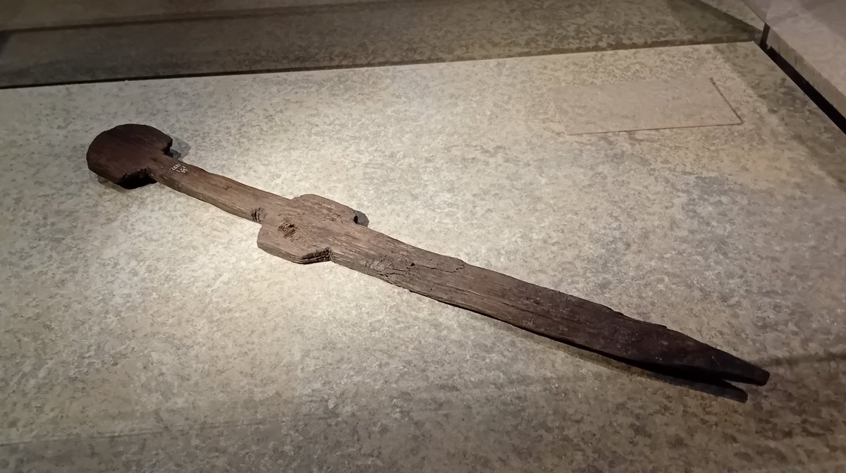 DrJEBall's tweet image. A small wooden #Roman sword - from the size of it, probably a toy rather than a practice weapon, maybe something given to a soldier's child. Found in London, it is easy to imagine a child playing with it some 1600-2000 years ago #Archaeology #RomanArchaeology