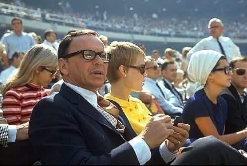 Frank Sinatra and Mia Farrow enjoying a day at the ballpark.