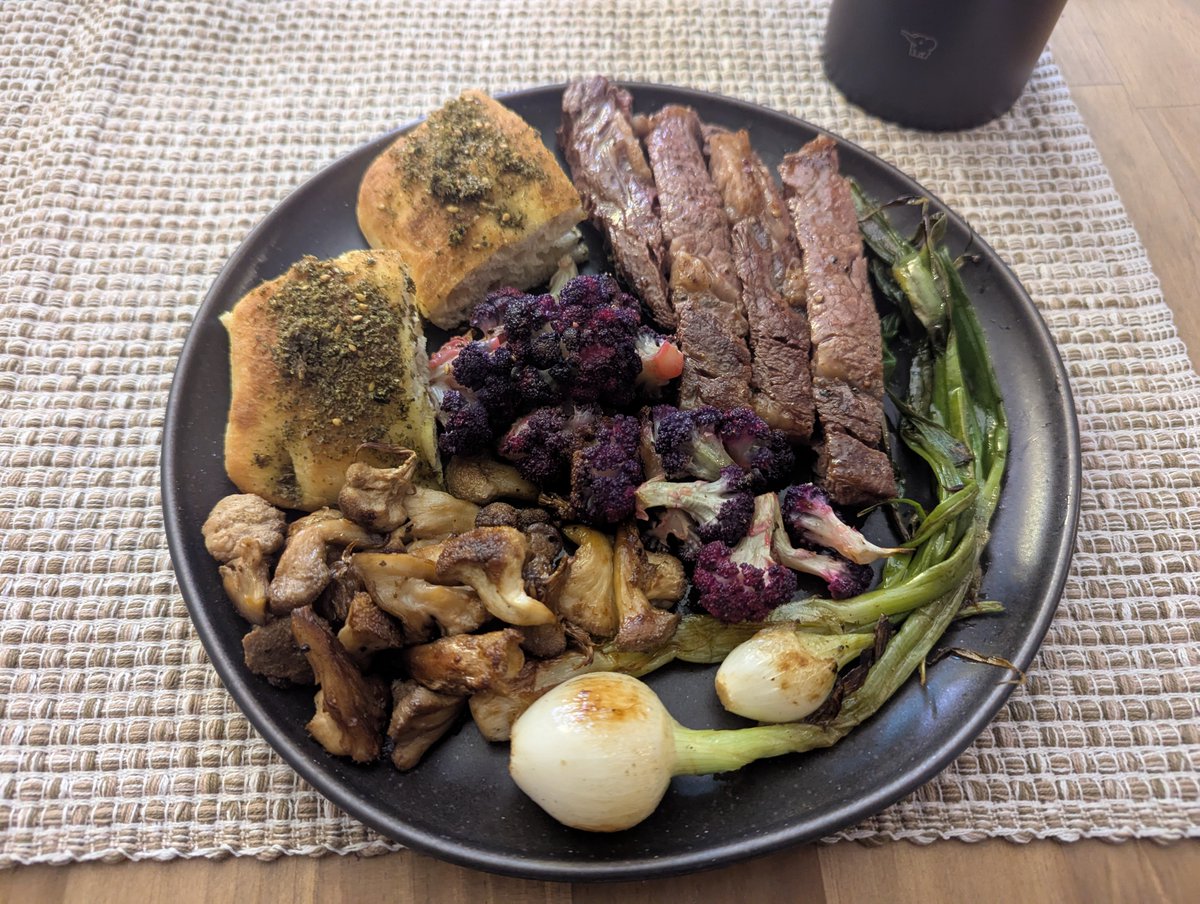 lychwake's tweet image. my boyfriend made dinner... bread with palestinian zaatar, steak, lion's mane, purple cauliflower, and cebollitas π