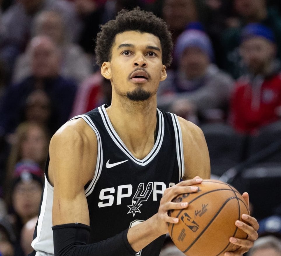esidery's tweet image. The Spurs’ current projected rotation next season:
Starters: De’Aaron Fox, Dylan Harper, Stephon Castle, Harrison Barnes, Victor Wembanyama
Second Unit: Devin Vassell, Carter Bryant, Keldon Johnson, Jeremy Sochan, Luke Kornet
San Antonio’s over/under win total is set at 42.5.