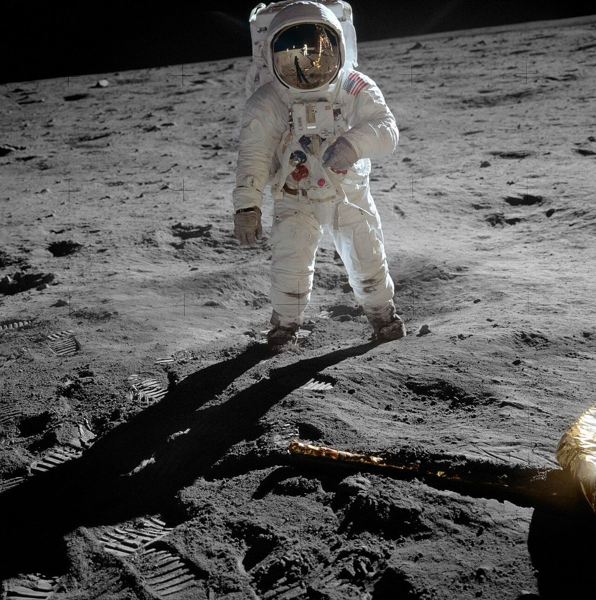 Buzz Aldrin on the Moon in a photograph taken by Neil Armstrong, who can be seen in the visor reflection along with Earth, the Lunar Module Eagle, and the U.S. flag, 1969.