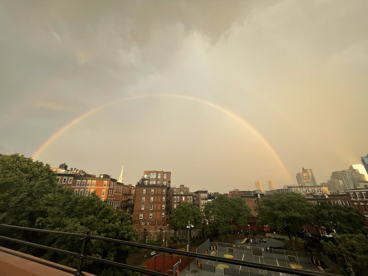 Jbukow2's tweet image. Gorgeous rainbow behind the storms in Boston @ericfisher @NWSBoston #mawx