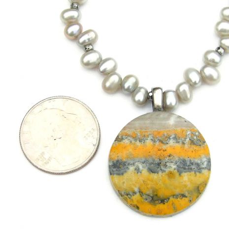 ShadowDogDesign's tweet image. New! Eye-catching #bumblebee jasper pendant #necklace w/ AA luminous lt. gray top-drilled #pearls! via @ShadowDogDesign #ShopSmall #Handmade #SaveTheBees #GemstoneNecklace bit.ly/BuzzingSD