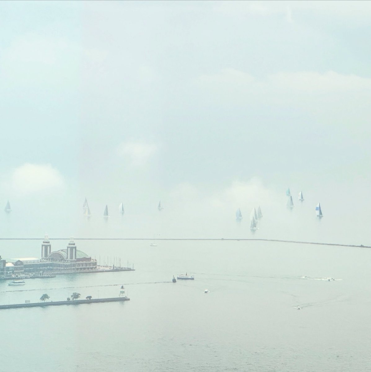 NancyAFrench's tweet image. There was a sailboat race on Lake Michigan this weekend when the water and the sky were the same exact color. This created the optical illusion that the boats were sailing in the sky!