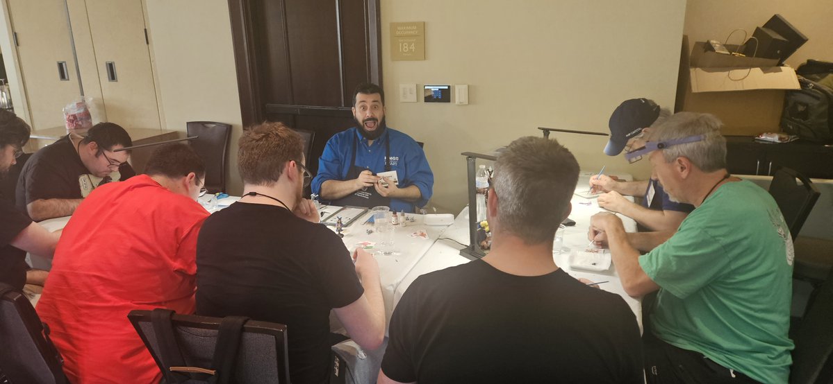 HMGS_Inc's tweet image. Greg helped hobbyists lose their fear of freehand painting by teaching simple ways to transfer designs onto banners and armor plates. Adding personal flair became easier during this inspiring Saturday 6PM session at @HMGS_HOBBY_U. #historicon2025