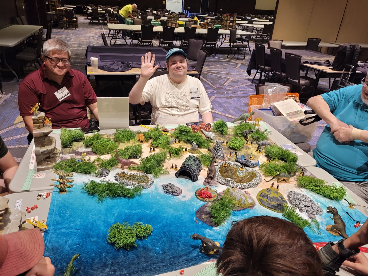 HMGS_Inc's tweet image. Eat Hitler! sent players stomping through the Age of Dinosaurs as hungry carnivores on the hunt for time-traveling Nazis. With each bite, they clawed their way toward the title of King Dinosaur in this fast-paced, toothy finale hosted by Brendan Watts. #Historicon2025