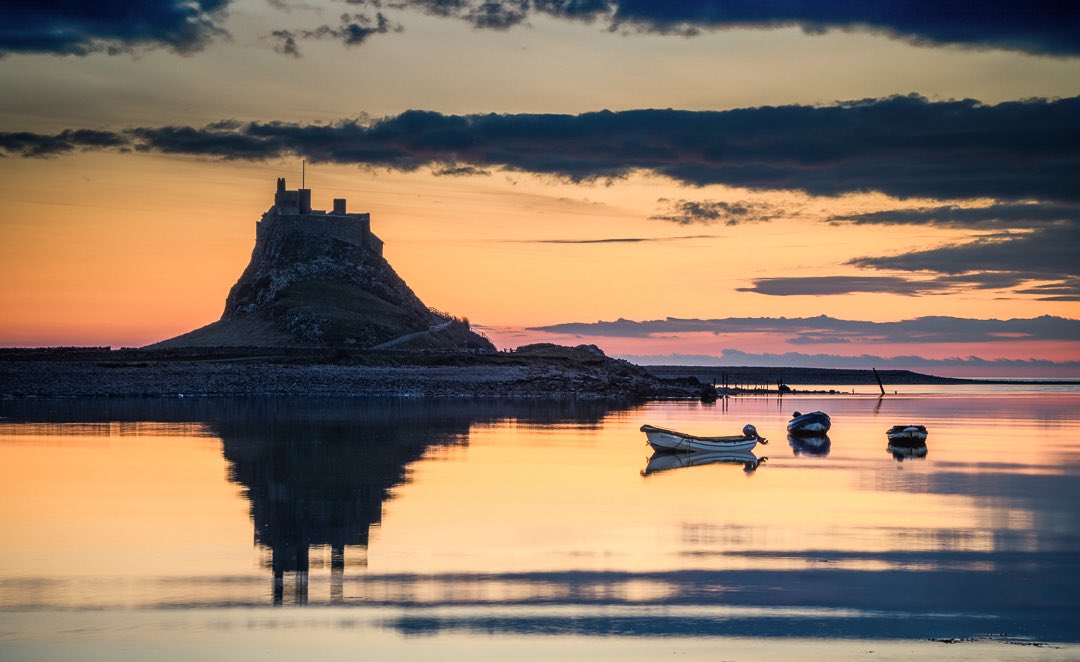 jimscottphoto's tweet image. Sunrise over the harbour on Holy Island.