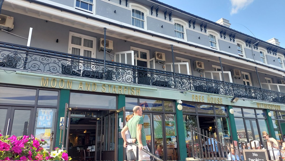 Wetherspoons, Clacton. Usual fare, very busy on a weekend. Extensive outdoor terrace and in an imposing position in the town, opposite the pier. The Moon &amp; Starfish.