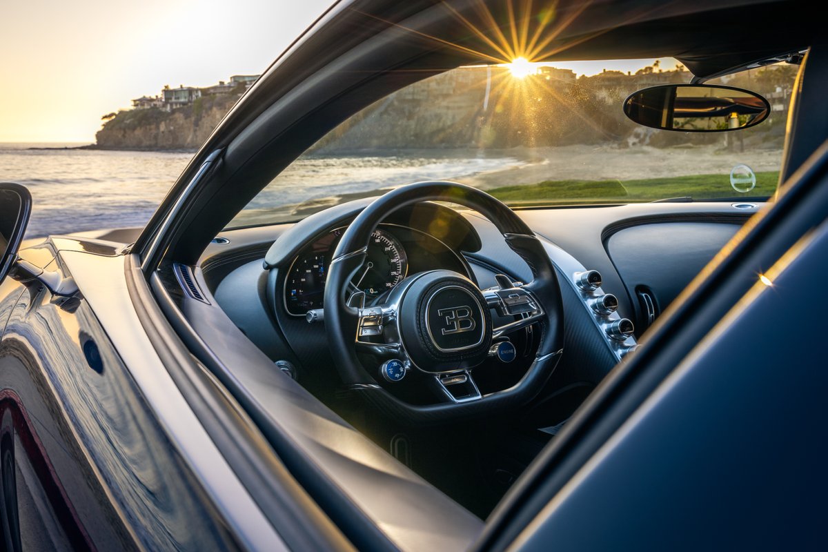 Bugatti's tweet image. The CHIRON, framed by the golden hues of the California sunset. 420 km/h. Excellence and comfort in its purest form.
#BUGATTI #CHIRON