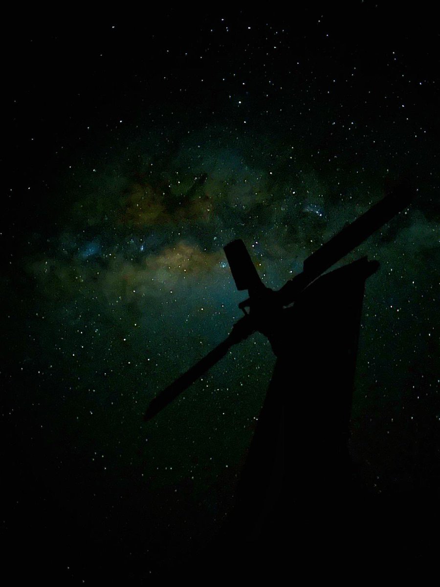 RNASCuldrose's tweet image. The tail rotor of a @RoyalNavy Merlin helicopter silhouetted against light from the billions of stars in our Milky Way galaxy. Photo taken from the flight deck of @HMSPWLS off Australia by Lt Emma Reynolds, a helicopter pilot with @820NAS #CSG25