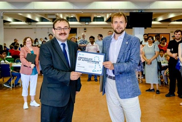 ecfchess's tweet image. 🎉Congratulations to Alex Holowczak on receiving a FIDE Certificate of Excellence for the Year of Social Chess! ♟️Known for his work in top tournaments, Alex also significantly contributes to local chess from school events to mentoring arbiters.