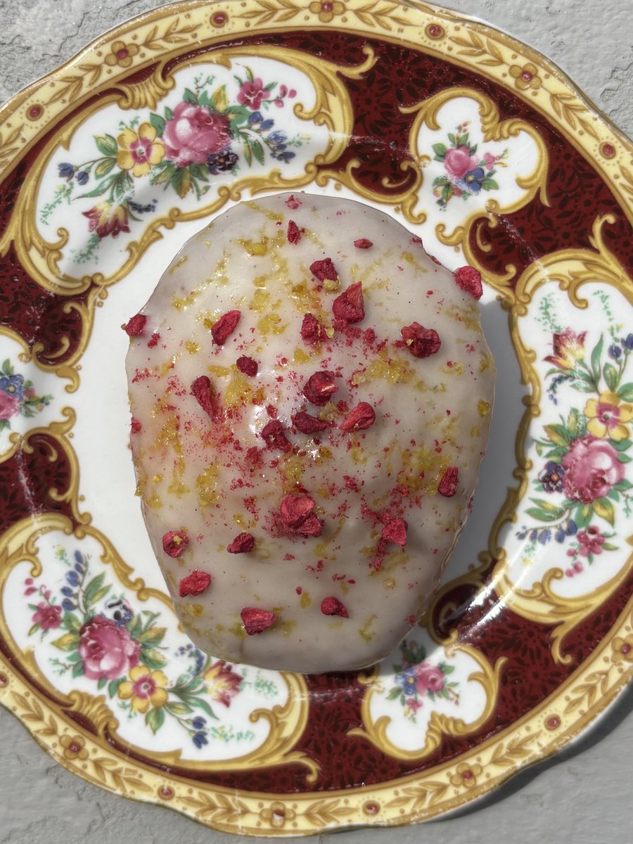 bakingenjoyer's tweet image. lemon madeleines filled with raspberry jam, topped with a lemon and vanilla bean glaze !!