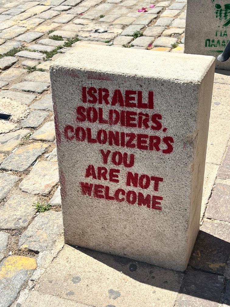 GraffitiRadical's tweet image. Stencil denouncing Israeli soldiers seen in Crete, Greece