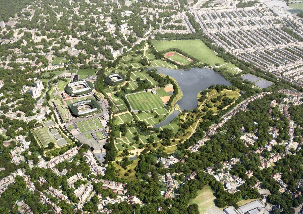 TheB1M's tweet photo. Controversial plans for an 8,000-seat new show court at Wimbledon are set to proceed after the UK’s High Court today rejected a legal challenge by the campaign group Save Wimbledon Park.

The plans were approved by the Greater London Authority last year, despite several thousand objections. Designed by Allies and Morrison, the venue will join the large Centre Court and No.1 Court arenas that already stand on the famous site.

Featuring a retractable roof, the new venue has been carefully designed to minimise its impact on the surrounding parkland.

Despite that, much of the opposition to the new court — and wider expansion of the site — centred around the development of Wimbledon Park, a Grade II listed Registered Park and Garden that was landscaped by Capability Brown in the 18th century.

Save Wimbledon Park has indicated that it will challenge today’s High Court ruling. 

Alongside the new permanent arena an additional 38 tennis courts are also planned but with temporary seating and careful positioning within the landscape.

Completion of the new court will enable the All England Lawn Tennis Club to move its qualifying tournament from Roehampton to the main Wimbledon site.

📷 Allies and Morrison