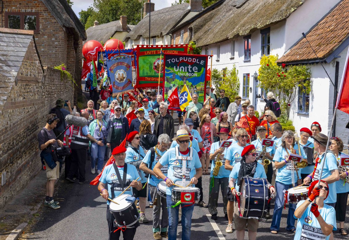 BenClaimant's tweet image. During this years #TolpuddleFestival t-shirts were handed out by @unitetheunion to show solidarity with @Dis_PPL_Protest.
There's been times recently when disabled people have felt alone in our struggle so seeing the band heading the march wearing DPAC t-shirts meant a lot.