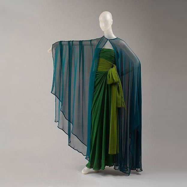 TheVFG's tweet image. 1989 Yves Saint Laurent evening dress showcases the designer’s celebrated mastery of draping and hue.
From the wardrobe of Nan Kempner, a devoted patron of Saint Laurent’s work, the gown reflects the designer’s late 1980s romanticism. The MET