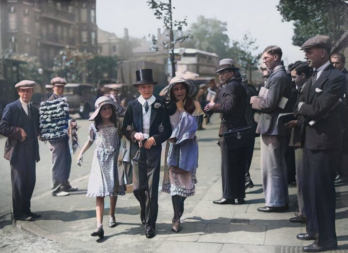 An Etonian arrives at Lord's with his two sisters for the annual match against Harrow.  The two-day game was part of the London 'season' and attracted sizeable crowds - in 1914, 38,000 watched the two days