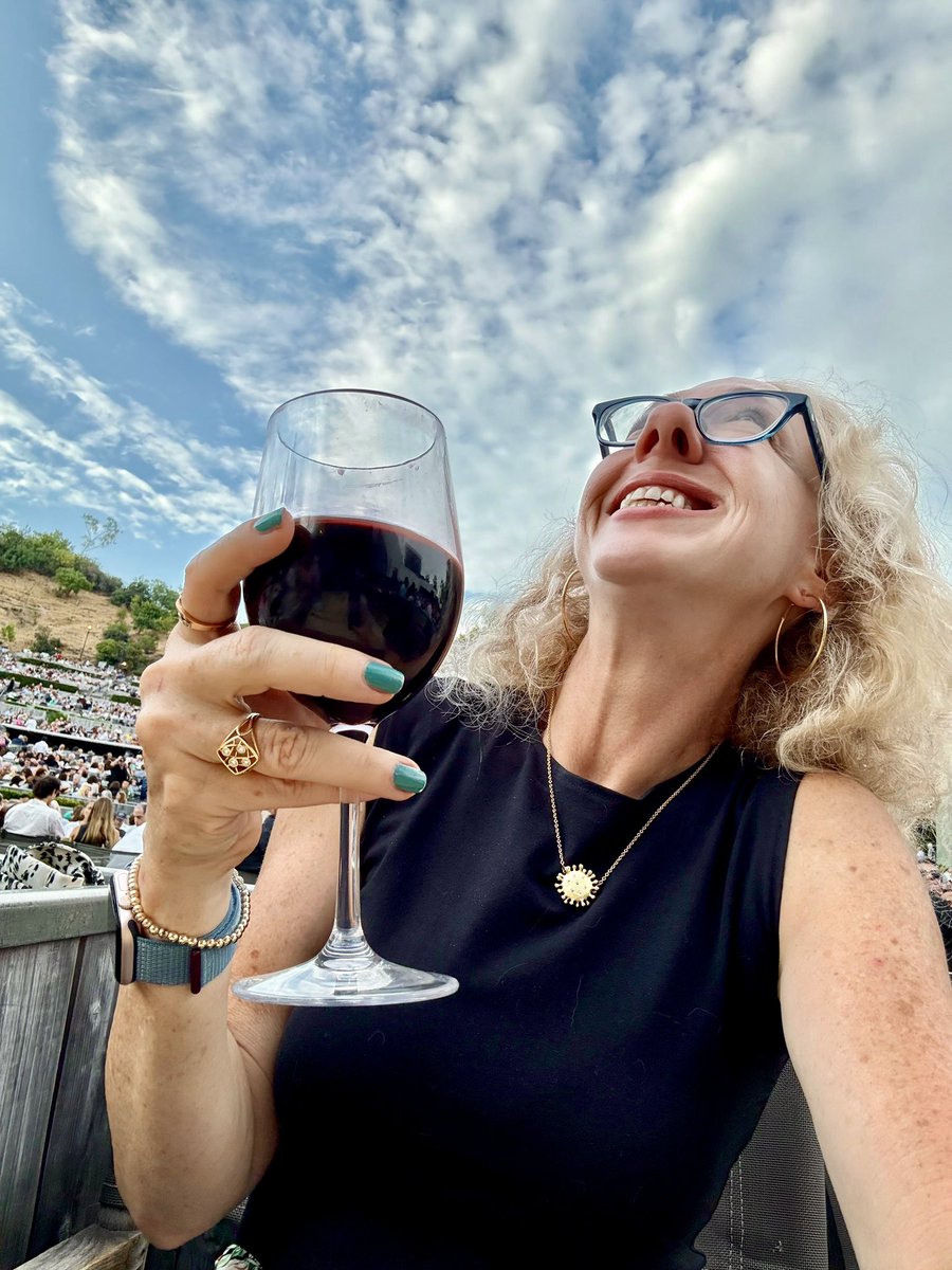 Sipping some of Californias finest at the Hollywood Bowl, while one of my devoted clients foots the bill. His wallet weeps, but my palate sings.🍷