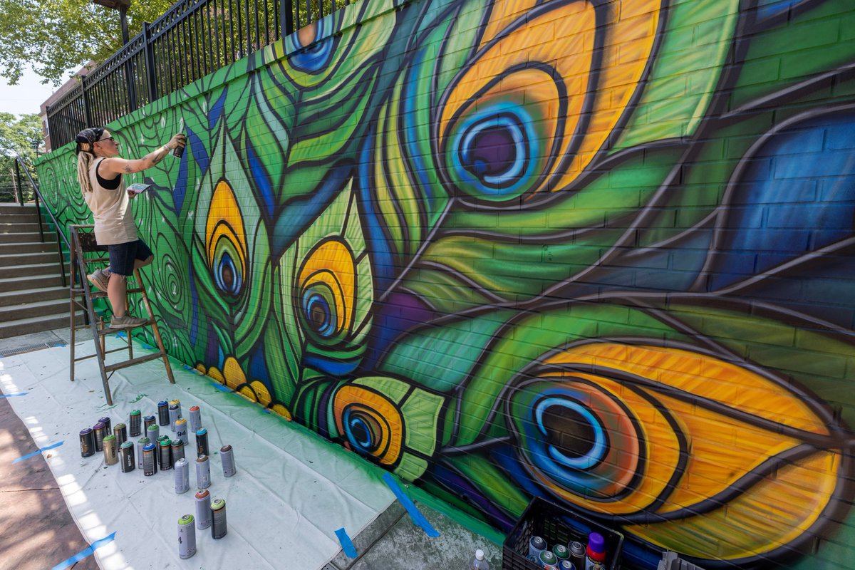 JerseyCity's tweet image. The Jersey City Mural Arts Program partnered with a group of Saint Peter's staff members and students to create a mural that really spoke to Saint Peter's and their Peacock mascot. The design of "Saint Peter's" was done by mural artist Jenna Morello @jennamorello