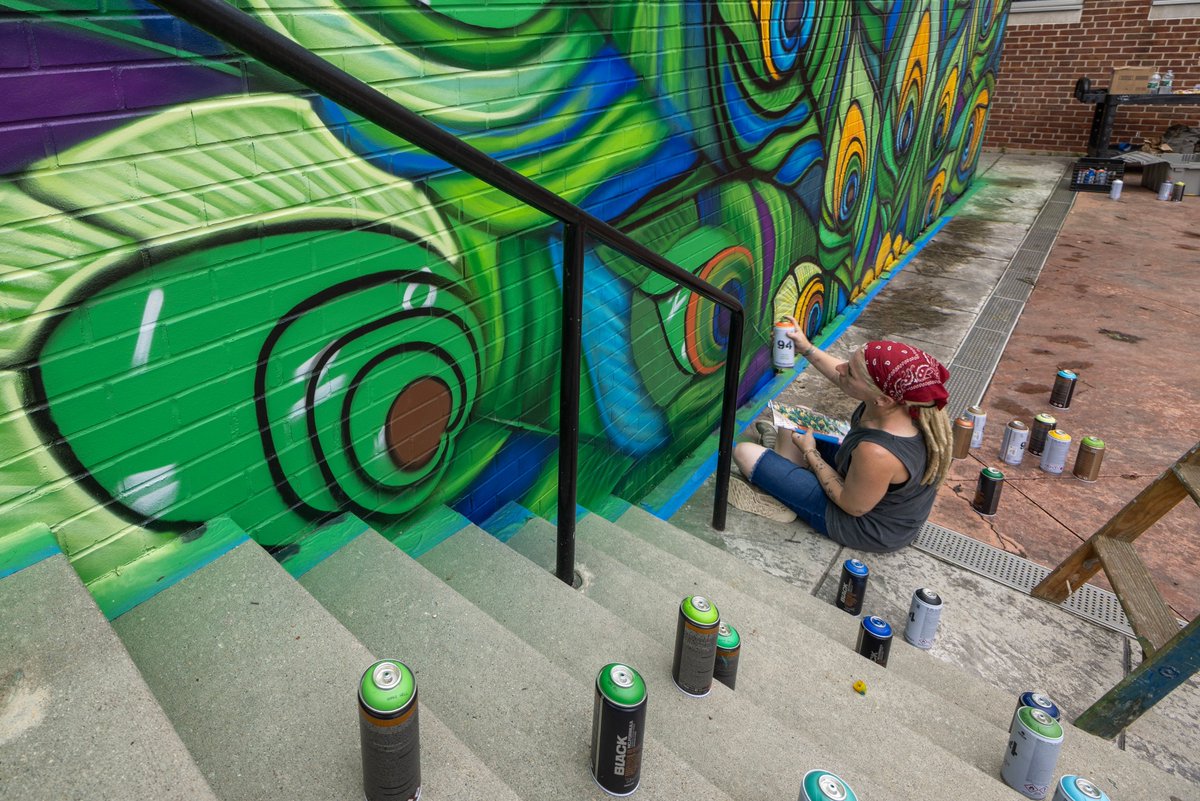 JerseyCity's tweet image. The Jersey City Mural Arts Program partnered with a group of Saint Peter's staff members and students to create a mural that really spoke to Saint Peter's and their Peacock mascot. The design of "Saint Peter's" was done by mural artist Jenna Morello @jennamorello