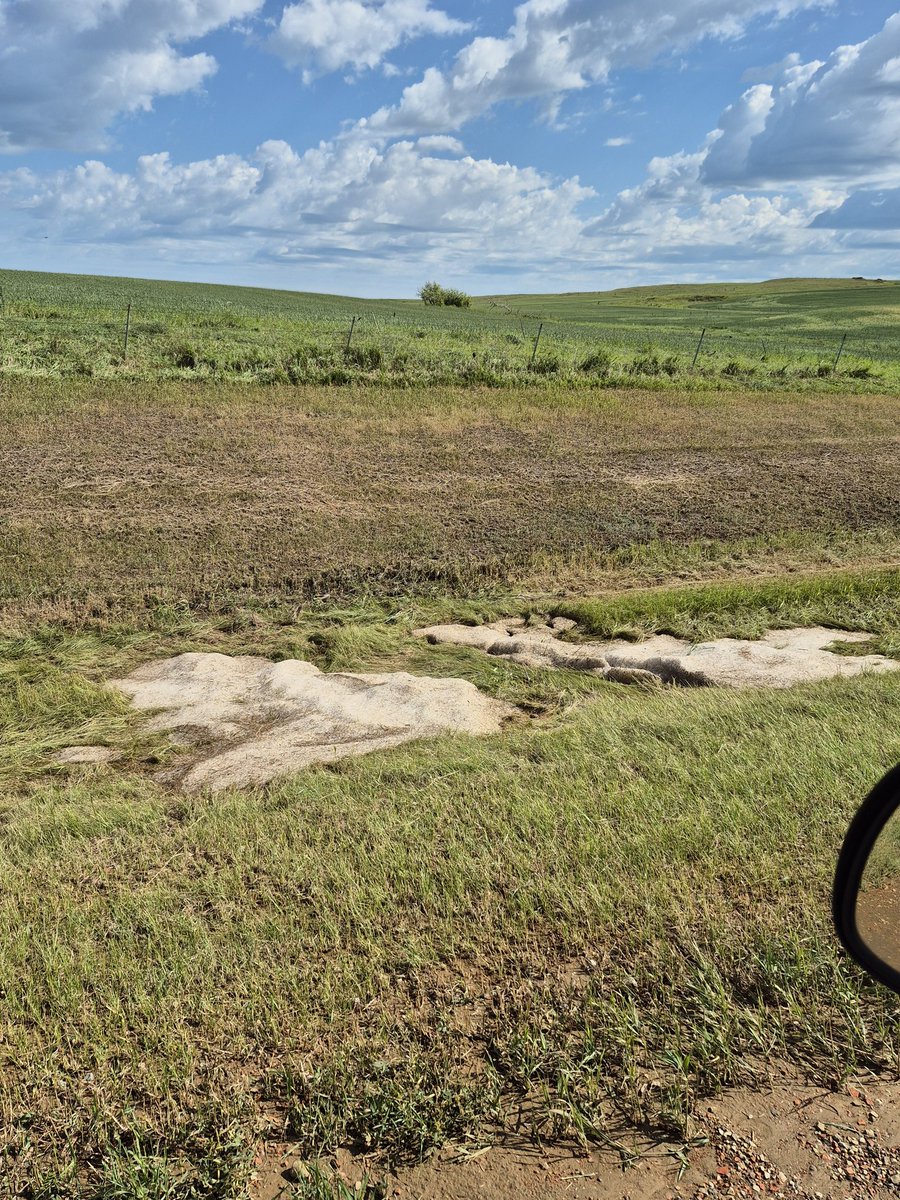 24 hours after and still drifts of hail