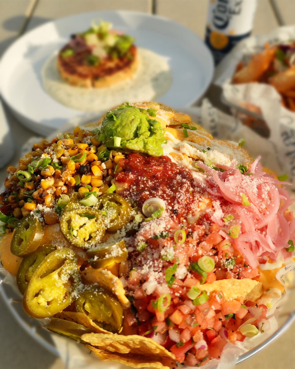 Beach views, cold drinks, and nachos the size of a small island.