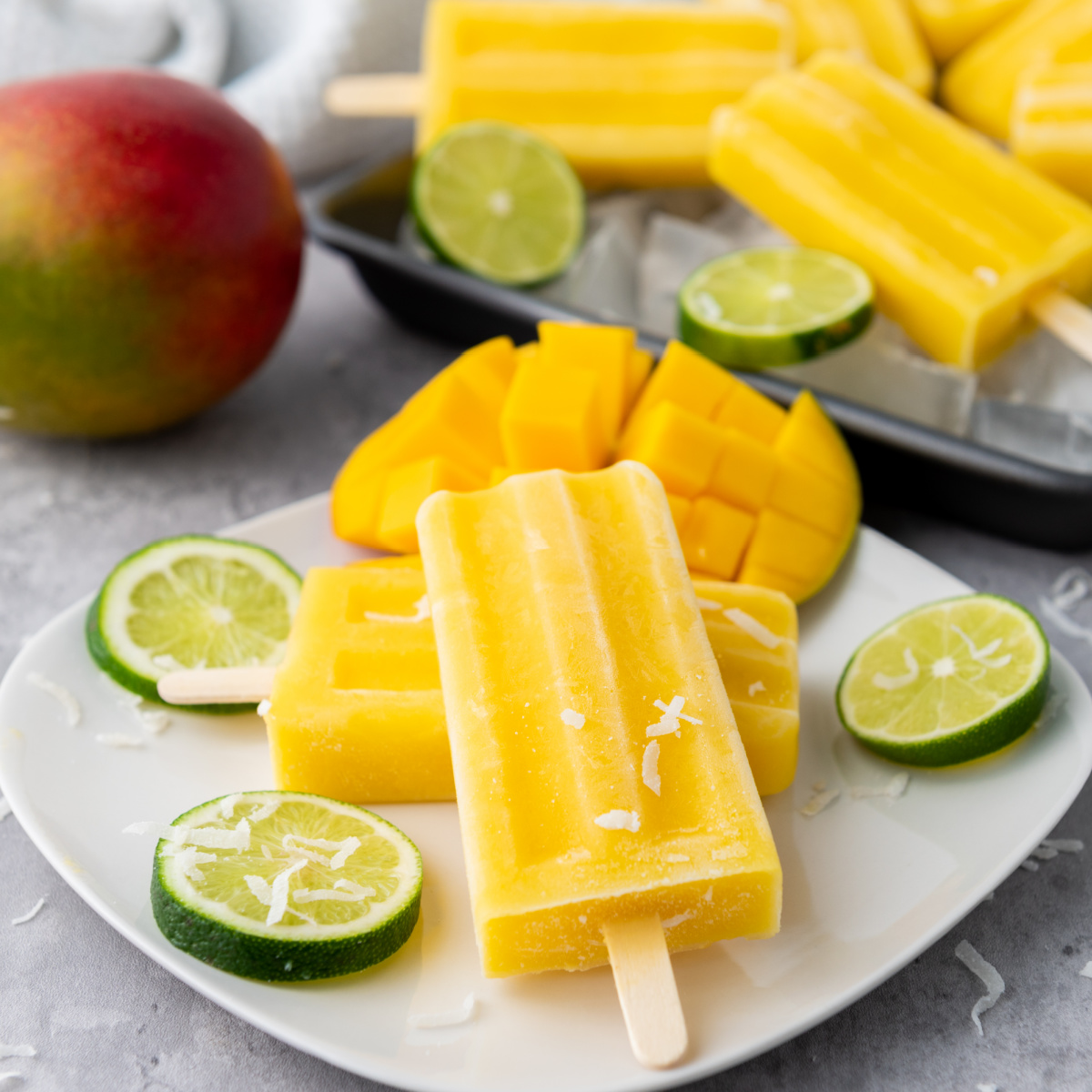 These Mango Coconut Lime Popsicles are an easy, dairy-free frozen treat made with just four ingredients. Packed with tropical flavors. blogghetti.com/mango-coconut-… #summerdessertweek #mango #popsicles