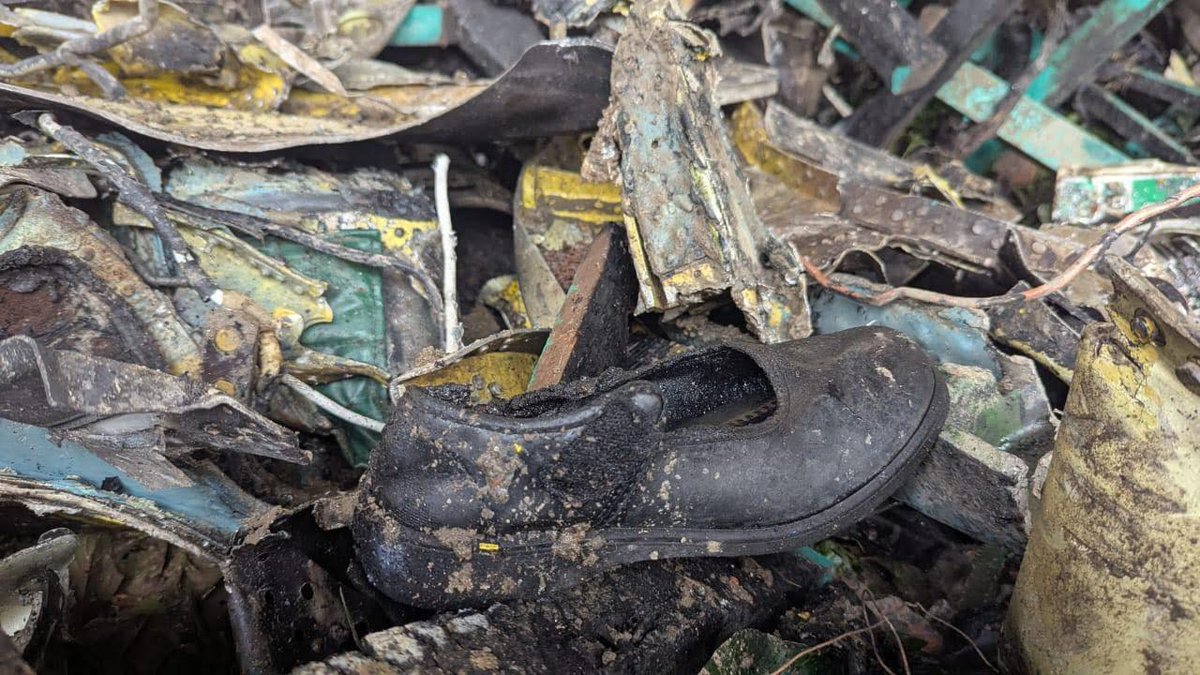 TughlaqiVandal's tweet image. A lone shoe of a schoolgirl lies among the wreckage of a crashed aircraft at Milestone school in Dhaka’s Diabari.