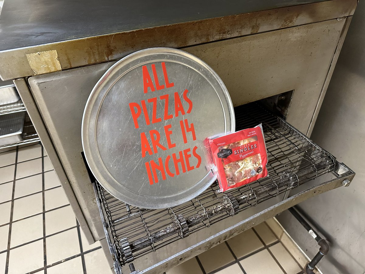 A rebel at heart, yesterday I microwaved a 6 inch frozen pizza in the “restaurant” that once had this sign hanging above its order window.

Now who wants to buy this big honkin’ pizza oven? This one-time kitchen needs to turn into our guest bedroom/ recording studio.