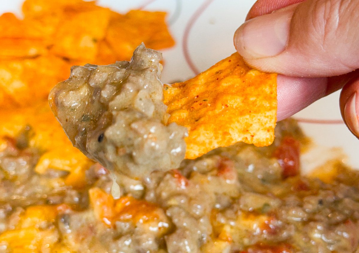 Check out this delicious Taco Bake Casserole for your next meal!  Super easy to make, this ground beef recipe quickly becomes a delicious favorite of taco fans everywhere!  #taco #tacocasserole #DoritoCasserole  #whatsfordinner thriftyniftymommy.com/taco-bake-cass… via @ThriftyNiftyMom