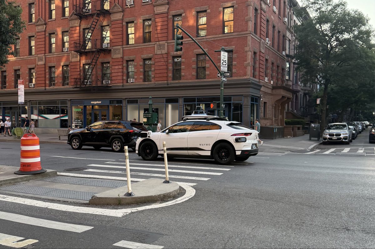 I get so excited every time I see a Waymo here in the city. Finally.