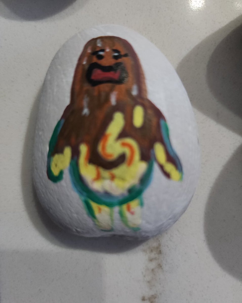 Or3_CS's tweet image. My mom paints flowers and other things on rocks so I told her to paint a cs2 charm. I sent her Hot Howl and Hot Wurst to paint and this was the result. 😂😂😂