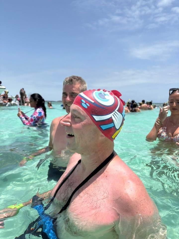 RodLacroix's tweet image. Never discount my dedication to a joke.
I found this swim cap in the gift shop. It was $10.
I bought it, thinking of everyone’s reaction when I put it on to swim with stingrays.
Now I have a $10 lightly used swim cap for sale of Facebook Marketplace for $0.50.