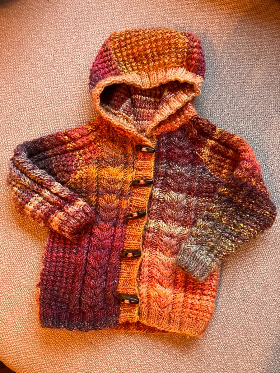 This one has been a slow project - I find it hard to knit when the weather is fine. The moment it clouds over my needles are clacking again. For my granddaughter.