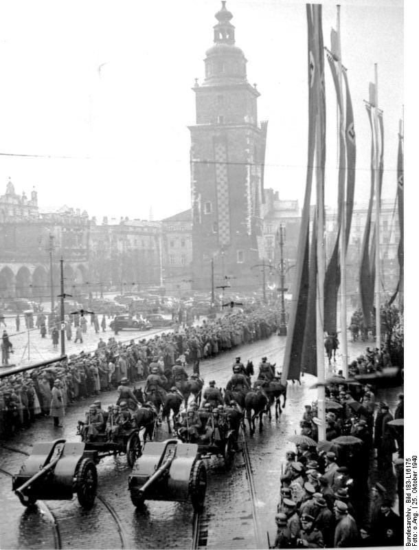 Deeteem1's tweet image. SS parade through Krakow in 1940. Today, I watched a Polish police graduation parade along the same route, with a Polish flag draped down the tower 🇵🇱💪
